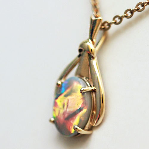 14k Yellow Gold Pendant with a SOLID SEMI BLACK OPAL From neon orange to beautiful blue